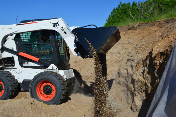 Top Dog 4 In 1 Bucket Outside Dumping Sediment